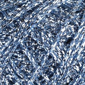 May include: A dense, tightly wound ball of metallic light blue yarn. The strands feature a highly reflective, shimmering finish that creates a bright, multi-faceted appearance with intersecting lines of silver and cool blue tones throughout.