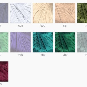 May include: A collection of embroidery floss spools in various colors, including light blue, white, beige, light pink, green, light green, purple, teal, dark green, gray, and burgundy.