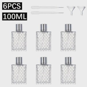 May include: Six clear glass bottles with silver caps, each featuring a diamond pattern. The bottles are 100ml in size. Two droppers and two funnels are also included. The text "6PCS" and "100ML" are in the image.