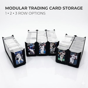 May include: Modular trading card storage units in black plastic, featuring 1, 2, and 3 row configurations filled with baseball cards. The text MODULAR TRADING CARD STORAGE 1 • 2 • 3 ROW OPTIONS is displayed at the top of the image.