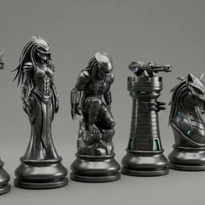 May include: A set of six metallic grey chess pieces, each sculpted in the likeness of a Predator character. The pieces include a bust, a standing figure, a kneeling figure, a turret, a horse head, and a crouching figure.