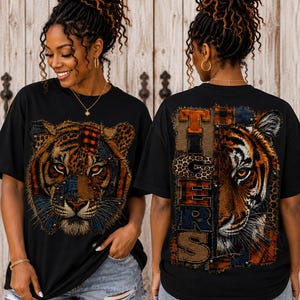 May include: A black short-sleeve t-shirt featuring a graphic print of a tiger face composed of various textured fabric patches on the front, and the word TIGERS alongside a partial tiger face graphic on the back of the garment.