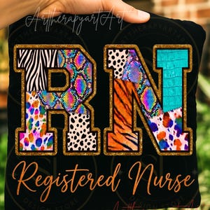 May include: Black pillow with the letters "RN" in a gold outline, each letter filled with a different animal print pattern. The words "Registered Nurse" are written in orange script below the letters.