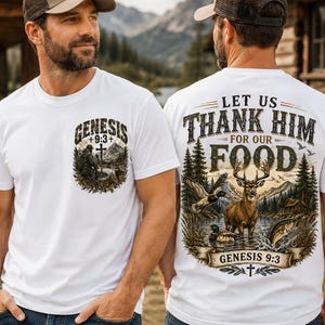 May include: A white t-shirt featuring a graphic print on the front and back. The front shows a hunter, a deer, and the text Genesis 9:3. The back displays a large nature scene with a deer, ducks, a fish, and the text Let Us Thank Him For Our Food.
