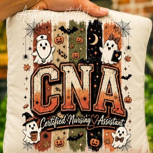 May include: A square off-white pillow featuring a graphic print with the text CNA Certified Nursing Assistant. The design includes four ghosts, pumpkins, bats, spiderwebs, and autumn leaves over vertical stripes in orange, green, and black.