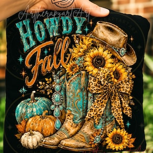 May include: A black fabric square featuring a graphic print with the text HOWDY Fall in turquoise and orange. The design includes a brown cowboy hat, two turquoise and brown cowboy boots, sunflowers, pumpkins, a leopard print bow, and turquoise jewelry.