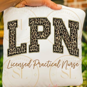 May include: White cushion featuring the letters "LPN" in a leopard print pattern with gold glitter edging. The words "Licensed Practical Nurse" are written in a brown script font below. A hand is holding the cushion.