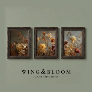 May include: Three rectangular wall art prints in dark wood frames, each featuring a detailed botanical illustration of dried flowers in shades of yellow, orange, and brown. Below the frames, the text reads WING & BLOOM NATURE MEETS DESIGN.