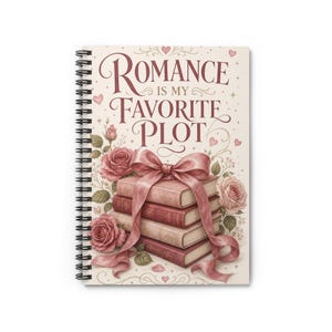 May include: A spiral-bound notebook featuring a cream-coloured cover with the text "ROMANCE IS MY FAVOURITE PLOT" in dark red script. The design includes a stack of three books tied with a large pink ribbon, surrounded by pink rose illustrations.