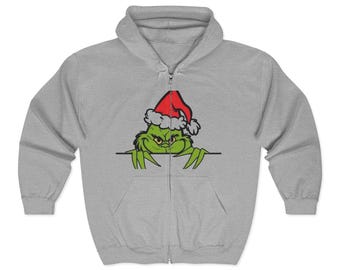 Sudadera navideña con capucha y cremallera con gorro de Papá Noel y cara de Grinch gruñón