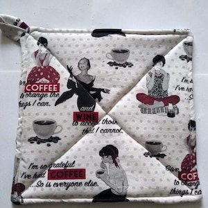 May include: Square quilted pot holder with a white background and small gray polka dots. The pot holder features vintage-style illustrations of women, coffee cups, and text that reads "Coffee to change the things I can" and "Wine to accept those that I cannot."