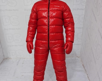 May include: A bright red, full-body puffer jumpsuit with a glossy finish. It features a hood that zips up to the top, long sleeves with integrated mittens, and attached boots. The text "Pridex Style" is printed in white on the left chest area.
