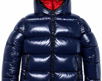 May include: A glossy navy blue puffer jacket featuring a high collar and a hood with a vibrant red interior lining. The jacket has horizontal quilted panels, a full-length black front zip, and two side pockets with black zip closures.