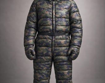 May include: A camouflage-patterned, hooded snowsuit with a black belt and attached mittens and foot coverings. The snowsuit has the letters "PS" embroidered on the chest. The suit is designed for cold weather.
