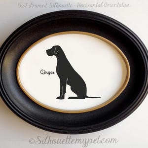 May include: A framed silhouette of a dog named "Ginger" in a black oval frame. The dog is depicted in black against a white background. The frame has a gold inner border and the text "5x7 Framed Silhouette - Horizontal Orientation" is at the top.