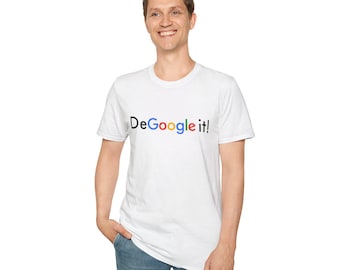 May include: White t-shirt with the text "DeGoogle it!" in a colorful, multi-colored font. The shirt is short-sleeved and worn by a person in blue jeans.