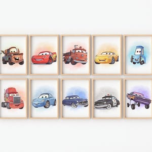 May include: Nine framed watercolor prints of cartoon cars, including a red fire truck, a yellow sports car, and a blue tow truck. Each print has a light-colored wooden frame and a colorful background.