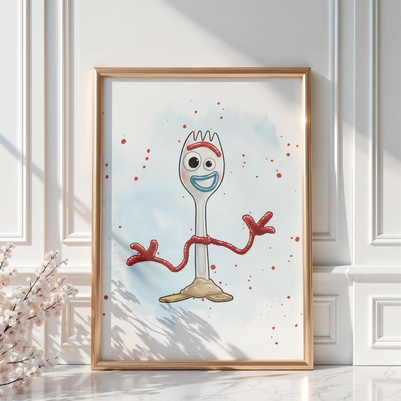May include: A framed print featuring a cartoon character resembling a spork. The character has a white body, a red arm, and a smiling face with blue and white details. Red paint splatters and a blue watercolor background complete the design.