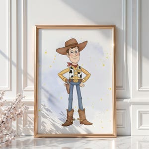 May include: A framed print featuring a cartoon illustration of a cowboy character. The character wears a brown cowboy hat, a yellow plaid shirt, a vest, blue jeans, and brown boots. The background has a watercolor effect with yellow splatters.