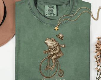 Off to Cause a Kerfuffle T-Shirt | Funny Frog Tee | Bicycle Graphic Shirt | Quirky Animal Humor