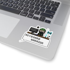 May include: A sticker depicting a pixelated ninja at a computer, wearing a green hat and black outfit. The sticker includes the text "KEYBOARD WARRIOR" in a speech bubble, ideal for tech enthusiasts.