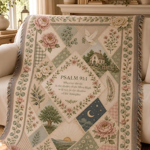 May include: A woven throw blanket featuring a diamond-patterned design with floral motifs, a white dove, a small house, a tree, a crescent moon, and the text Psalm 91:1: Whoever dwells in the shelter of the Most High will rest in the shadow of the Almighty.