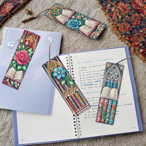 May include: A white ceramic mug with a black handle and the text "But First, Coffee" in a bold, black font. The mug is set against a blurred background, suggesting a cosy setting.