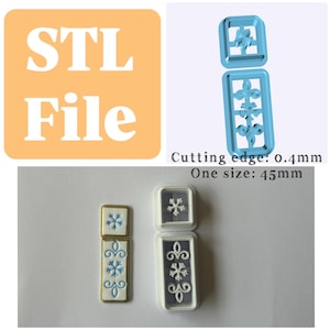 May include: Two light blue 3D printed cookie cutters with a snowflake and scroll design, labeled STL File. The cutters have a 0.4mm cutting edge and a 45mm size. Next to them are white clay impressions showing the snowflake and scroll patterns.