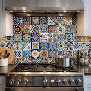 May include: A kitchen backsplash featuring a vibrant array of patterned tiles in shades of blue, yellow, orange, and white. The tiles create a colorful mosaic design. A stainless steel stove with a pot on top is in front of the backsplash.