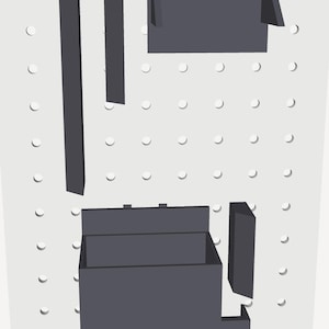 May include: A set of dark gray modular storage components including a rectangular box with an open top, two long vertical strips, and two smaller rectangular panels, all arranged against a white pegboard with a grid of circular holes.