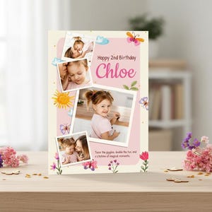 May include: A personalized birthday card with photos of a young girl, butterflies, and floral accents. The card reads "Happy 2nd Birthday Chloe." The design includes a pink and cream color scheme, with the text "Twice the giggles, double the fun, and a lifetime of magical moments."