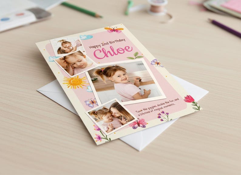 May include: A personalized birthday card with photos of a young girl named Chloe. The card features a pink and white design with butterflies, flowers, and the text "Happy 2nd Birthday Chloe". The card is on top of a white envelope.
