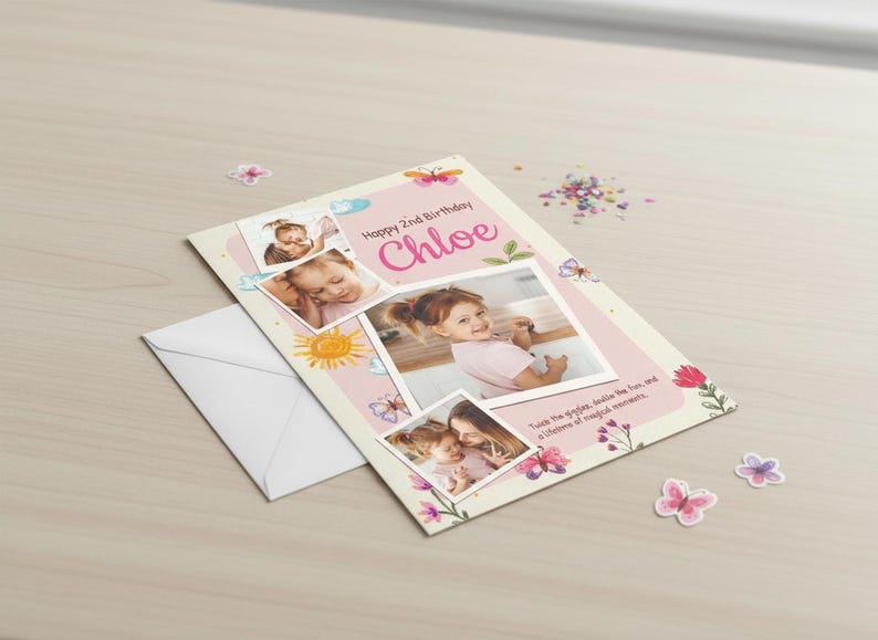 May include: A personalized birthday card with photos, butterflies, and flowers. The card says "Happy 2nd Birthday Chloe" in pink script. An envelope and confetti are next to the card.