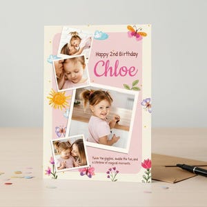 May include: A personalized birthday card with photos, featuring the text "Happy 2nd Birthday Chloe." The card has a pink background with floral and butterfly illustrations. The card includes the text "Twice the giggles, double the fun, and a lifetime of magical moments."