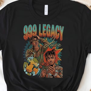 May include: Black t-shirt featuring a graphic of two people with the text "999 Legacy Juice". The design includes portraits, roses, and a broken globe, with a vintage style.