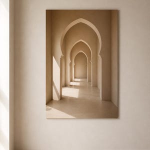 May include: A rectangular wall art print featuring a series of beige, pointed archways receding into the distance. The composition displays a monochromatic palette with soft, natural light casting shadows across the smooth, architectural surfaces.