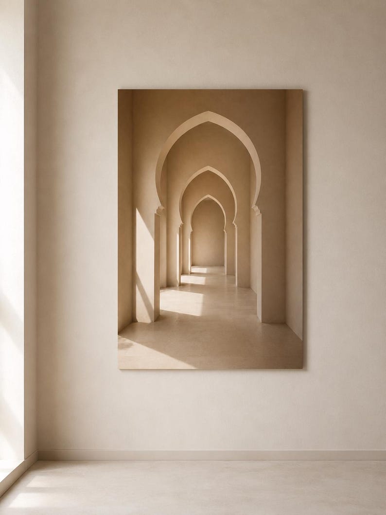May include: A rectangular wall art print featuring a series of beige, pointed archways receding into the distance. The composition displays a monochromatic palette with soft, natural light casting shadows across the smooth, architectural surfaces.