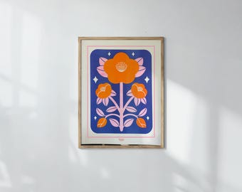 May include: A framed art print with a floral design. The print displays orange flowers with pink stems and leaves on a blue backdrop. The artwork is enclosed in a light brown wooden frame, adding a warm touch to the piece. The print is in a rectangular shape.