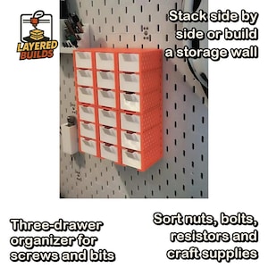 May include: A modular storage unit with orange frames and white drawers mounted on a white pegboard. The unit features eighteen individual compartments. Text on the image reads: Layered Builds, Stack side by side or build a storage wall, Three-drawer organizer for screws and bits, Sort nuts, bolts, resistors and craft supplies.