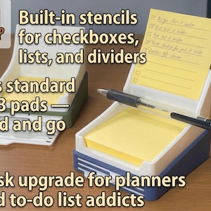 May include: Two plastic sticky note holders with built-in stencils for checkboxes, lists, and dividers. Each holder features a white top section for a 3x3 inch pad and a colored base. A black pen rests horizontally across the front of the blue holder.