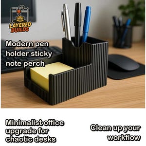 May include: A black, ribbed desk organizer featuring a vertical compartment holding a silver, a black, and a blue pen, alongside a lower square section containing a stack of yellow sticky notes. The unit displays the text Layered Builds.