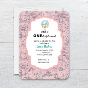 May include: A pink birthday invitation with a map design. The invitation features the text "what a ONEderful world" and details for Kate Fischer's first birthday, including the date, time, and location.