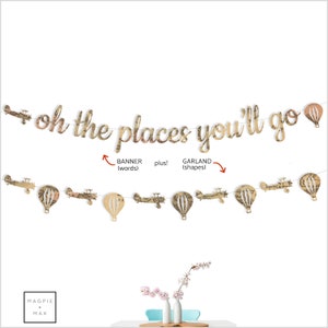 May include: A gold "Oh the places you'll go" banner with airplane and hot air balloon cutouts. The banner is made of paper with a vintage map design.