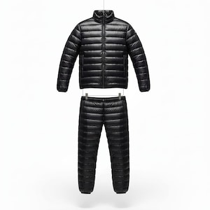 May include: A black, quilted down jacket and matching pants set. The jacket has a stand-up collar and a full-length zipper. The pants have an elastic waistband. Both pieces are made of a shiny, lightweight material, perfect for outdoor activities.