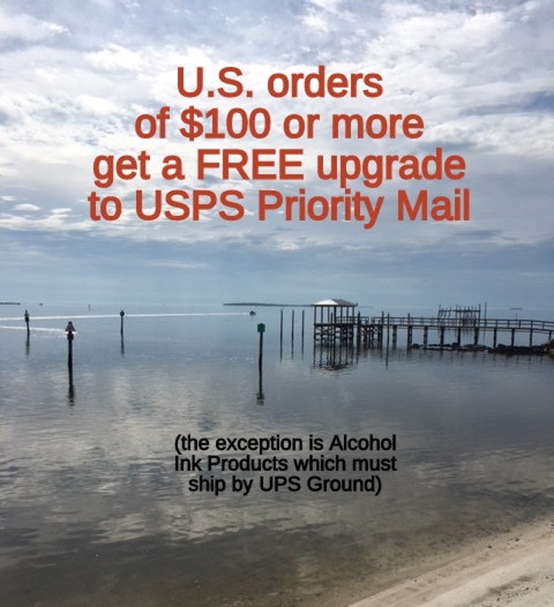 May include: A scenic image of a wooden pier extending into a calm body of water. The sky is a light blue with white clouds. The text "U.S. orders of $100 or more get a FREE upgrade to USPS Priority Mail (the exception is Alcohol Ink Products which must ship by UPS Ground)" is displayed in red text.