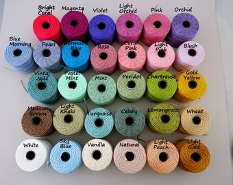 May include: A collection of 48 spools of embroidery floss in various colors, including bright coral, magenta, violet, light orchid, pink, orchid, blue morning, pearl, Bermuda blue, rose, coral pink, light pink, blush, vintage jade, pastel mint, mint, peridot, chartreuse, gold yellow, medium brown, light khaki, turquoise, celery, lemongrass, wheat, white, sky blue, vanilla, natural, light peach, and light gold.