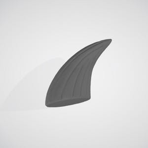 May include: A gray, curved horn with vertical ridges. The horn is smooth and appears to be made of a solid material. The object is set against a plain, light background.