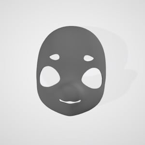 May include: A gray mask with large, oval eye holes and small, round holes above them. The mask has a small nose and a curved mouth, suggesting a smiling expression. The mask is likely for costume or decorative purposes.