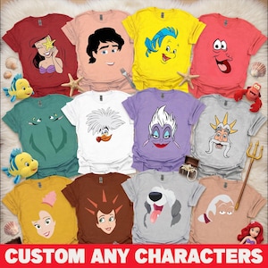 May include: A collection of colorful t-shirts featuring various cartoon character designs. The shirts are in shades of red, pink, yellow, green, white, purple, gray, brown, and tan. The text "CUSTOM ANY CHARACTERS" is displayed at the bottom of the image.