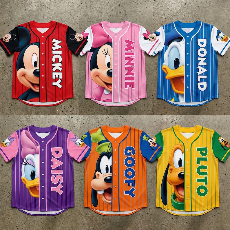 May include: Six baseball-style jerseys featuring Disney characters Mickey, Minnie, Donald, Daisy, Goofy, and Pluto. Each jersey has a character's face on the front and the character's name vertically down the side. The jerseys are red, pink, blue, purple, orange, and yellow.